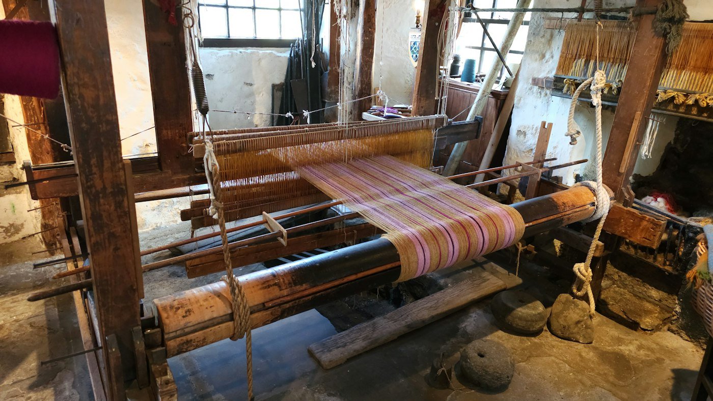 Artisan weaving a handloom rug in our Bhadohi workshop